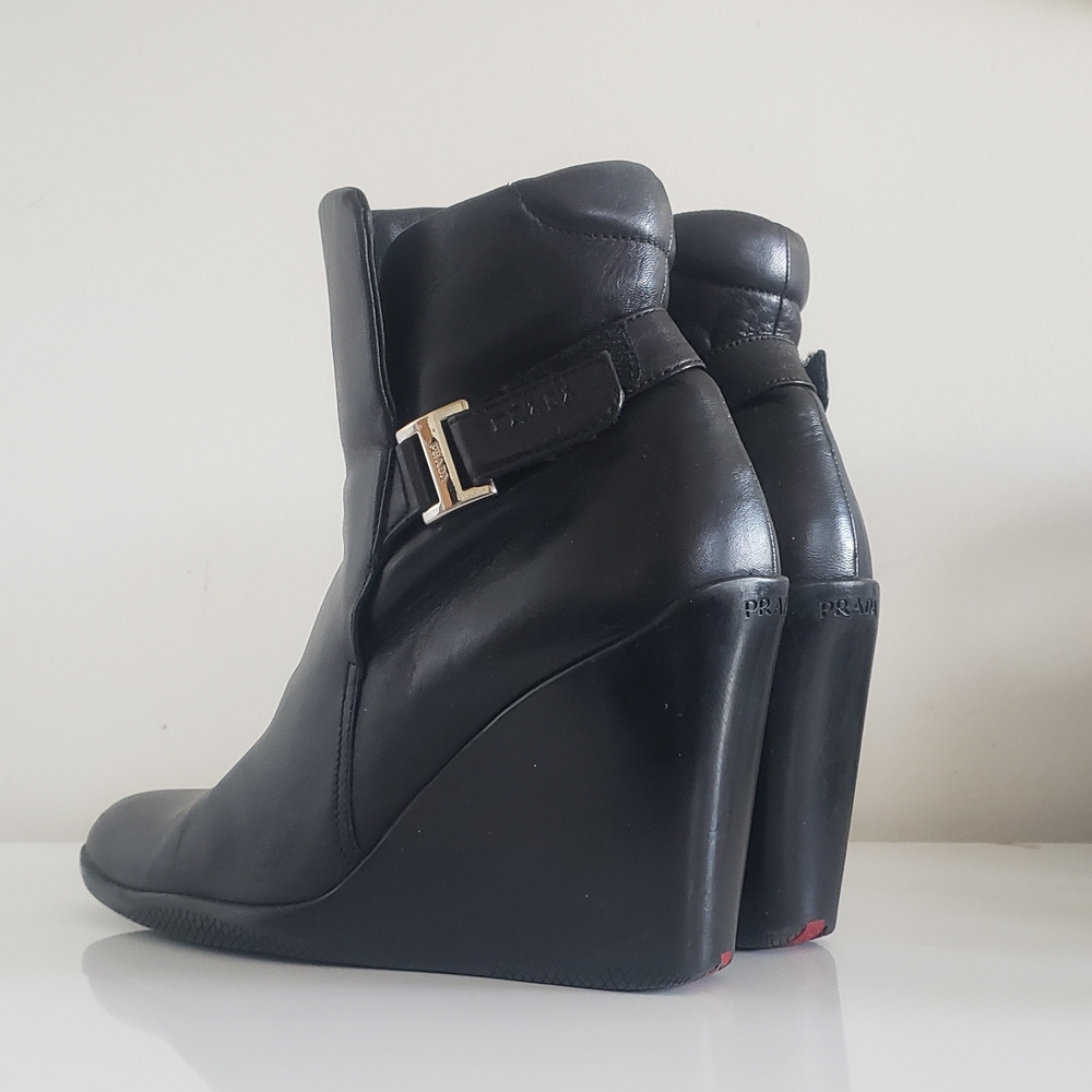 Prada Black Leather Wedge Ankle Boots with Gold Accent